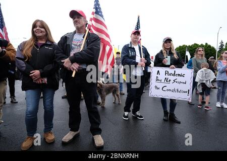 Vancouver, USA. 16th May, 2020. Protesters gather to show support for Kelly Carroll who officially opened her business, The Pet Biz, a luxury pet grooming operation in Vancouver, Wash., on May 16, 2020. The opening is a direct violation of Governor Jay Inslee's orders for non-essential business to remain closed at this time, but Kelly, who has already been operational for five days, insists she need to open to support her grand-daughters. (Photo by Alex Milan Tracy/Sipa USA) Credit: Sipa USA/Alamy Live News Stock Photo