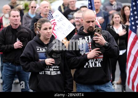 Vancouver, USA. 16th May, 2020. Protesters gather to show support for Kelly Carroll who officially opened her business, The Pet Biz, a luxury pet grooming operation in Vancouver, Wash., on May 16, 2020. The opening is a direct violation of Governor Jay Inslee's orders for non-essential business to remain closed at this time, but Kelly, who has already been operational for five days, insists she need to open to support her grand-daughters. (Photo by Alex Milan Tracy/Sipa USA) Credit: Sipa USA/Alamy Live News Stock Photo