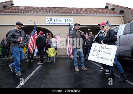 Vancouver, USA. 16th May, 2020. Protesters gather to show support for Kelly Carroll who officially opened her business, The Pet Biz, a luxury pet grooming operation in Vancouver, Wash., on May 16, 2020. The opening is a direct violation of Governor Jay Inslee's orders for non-essential business to remain closed at this time, but Kelly, who has already been operational for five days, insists she need to open to support her grand-daughters. (Photo by Alex Milan Tracy/Sipa USA) Credit: Sipa USA/Alamy Live News Stock Photo