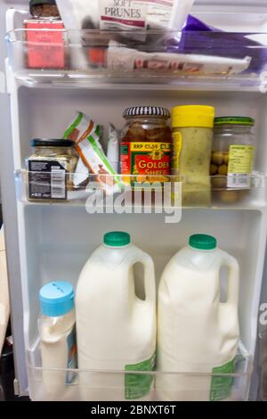 inside a tightly packed small fridge door Stock Photo