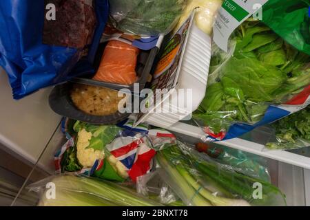 tightly packed small fridge with healthy food Stock Photo