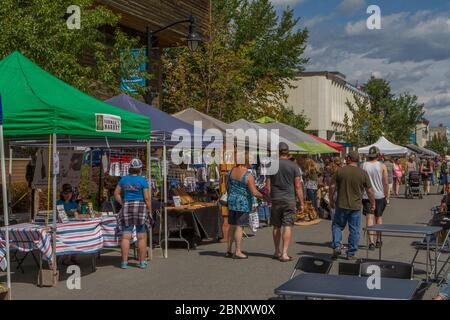 People shopping at outdoor  farmers market, on a suny day. Stock Photo