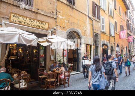 Romecity centre and people stroll the streets of Rome and enjoy lunch at a local cafe restaurant,Italy Stock Photo