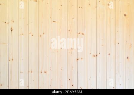 Background. A wall of vertical wooden boards, yellow - lining Stock Photo
