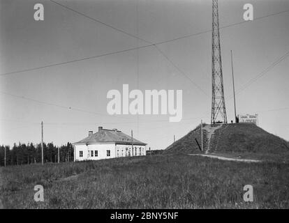 Old Lahti radio station, Lahti longwave transmitter, and the western radio mast, ca. 1928. by Archives of the Finnish Broadcasting Company Yle