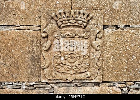 City emblem, coat of arms in stone relief, Medieval decorative art. Stock Photo