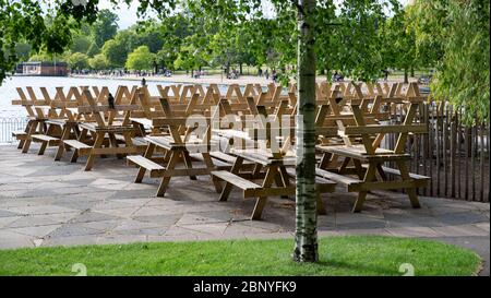 London, UK. 16th May, 2020. Tables of a restaurant are piled up in a park in London May 16, 2020, the first weekend after British Prime Minister Boris Johnson unveiled a lockdown exit roadmap on May 10. Credit: Han Yan/Xinhua/Alamy Live News Stock Photo