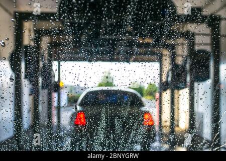 a car Running through automatic car wash. Stock Photo