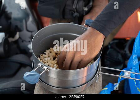 Making pop corn on boat Stock Photo