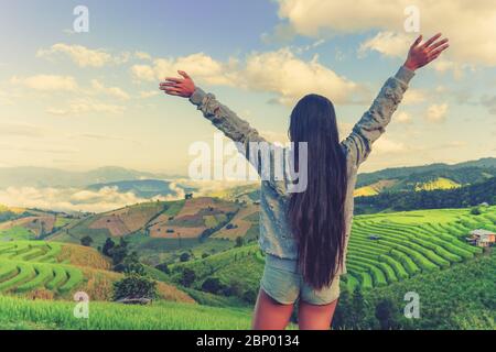 Young woman looking at beautiful tegallalang rice terrace in Bali, Indonesia Stock Photo