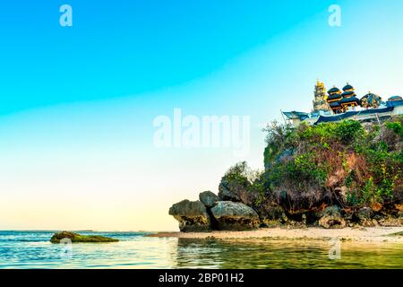 Traditional Balinese Hindu temple on top of mountain on background blue summer sky. Bali, Indonesia