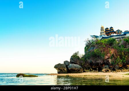 Balinese Hindu temple on top of mountain cliff on background beautiful nature landscape. Bali, Indonesia