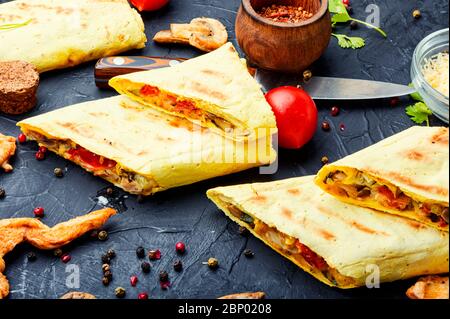 Traditional turkish shawarma with chicken,cheese and mushrooms. Stock Photo