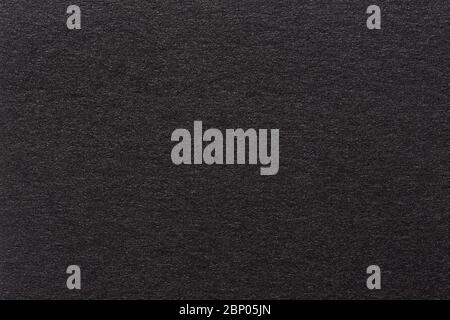 Wrinkled black paper texture or background made from paper. Stock Photo