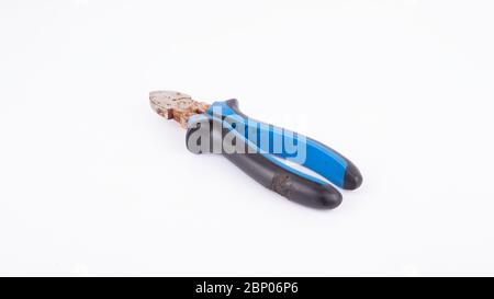 the old wire cutters with rubber handles isolate. tool, cable cutter. Stock Photo
