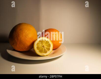 Citrus fruits on the white table. Still life Stock Photo
