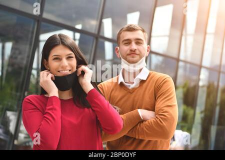 Business People team with protective medical safety Mask standing at Office Urban Building CoronaVirus in Business new normal outbreak Concept Stock Photo