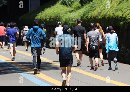 Tokyo, Japan. 17th May, 2020. Joggers train at a park in Tokyo on Sunday, May 17, 2020. Japanese government extended a state of emergency for Tokyo Metropolitan area on May 14. Credit: Yoshio Tsunoda/AFLO/Alamy Live News Stock Photo