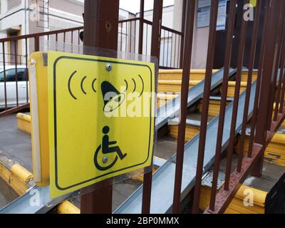 Information signs for people with disabilities near ramp on steps Stock Photo