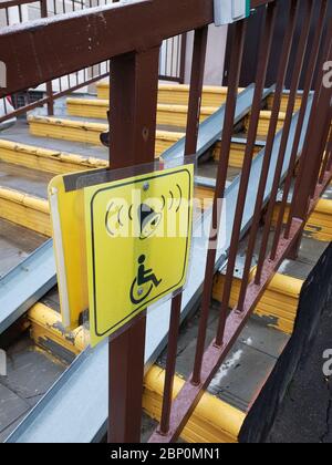 Information signs for people with disabilities near ramp on steps Stock Photo