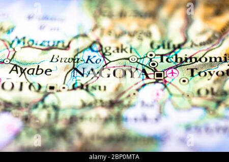 Shallow depth of field focus on geographical map location of Nagoya city in Honshu Island Japan Asia continent on atlas Stock Photo