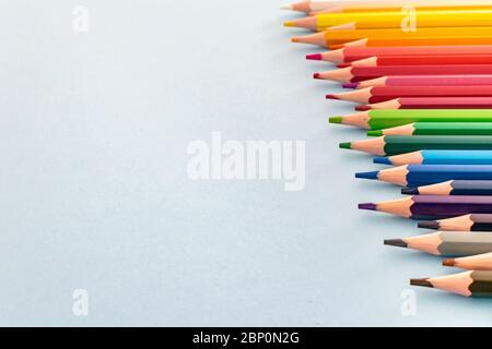 a set of colourful pencils lined up from dark to light Stock Photo