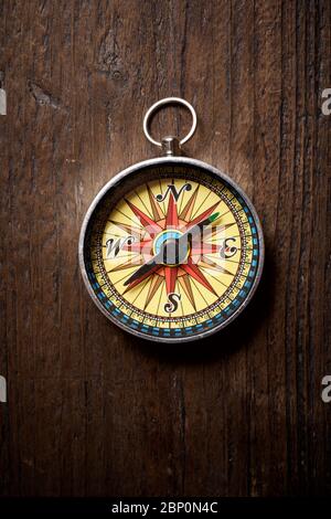 Vintage compass on a wood table. Stock Photo