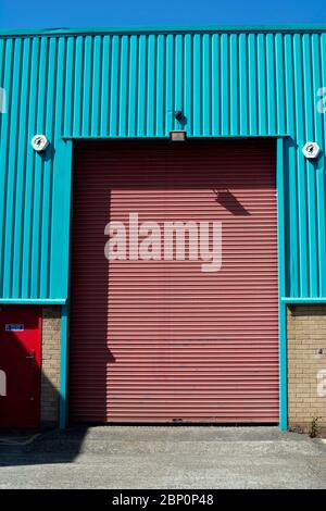 A roller shutter door on a small factory, Warwick, UK Stock Photo