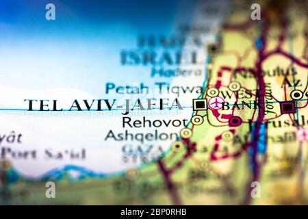 Shallow depth of field focus on geographical map location of Tel Aviv Jaffa Israel Asia continent on atlas Stock Photo