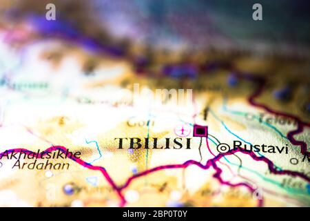 Shallow depth of field focus on geographical map location of Tbilisi Tiflis Georgia Asia Europe continent on atlas Stock Photo