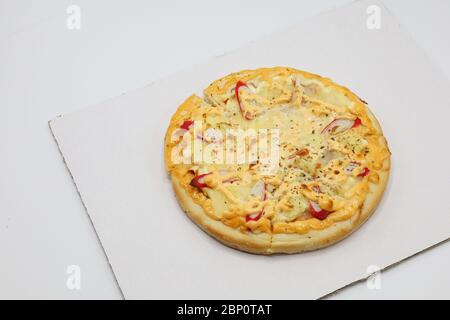 Pizza with chicken and sausage isolated on white background. Stock Photo