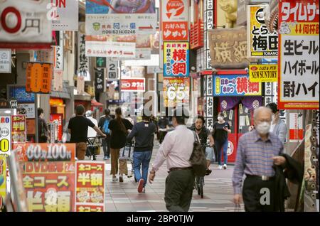 Osaka, Japan. 17th May, 2020. Many people walk in Osaka on May 17, 2020, the first Sunday after Osaka Prefecture partially lifted its business suspension request over the coronavirus pandemic. (Kyodo)==Kyodo Photo via Credit: Newscom/Alamy Live News