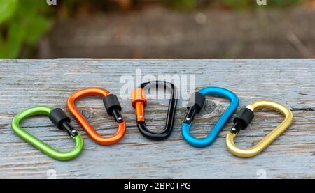 Metal carabine for mountaineering. Photo of colored carabines. Climbing concept Stock Photo