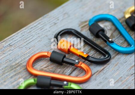 Metal carabine for mountaineering. Photo of colored carabines. Climbing concept Stock Photo