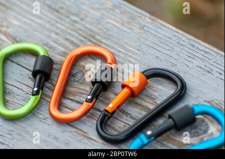 Metal carabine for mountaineering. Photo of colored carabines. Climbing concept Stock Photo