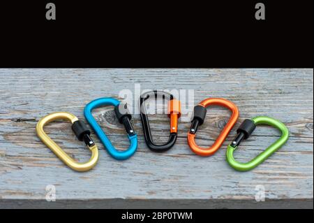 Metal carabine for mountaineering. Photo of colored carabines. Climbing concept Stock Photo