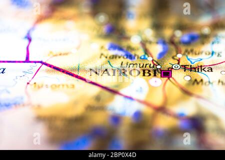 Shallow depth of field focus on geographical map location of Nairobi city in Kenya Africa continent on atlas Stock Photo