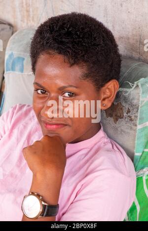 Young woman looking up into camera, Sigatoka (Singatoka), Fiji. Stock Photo