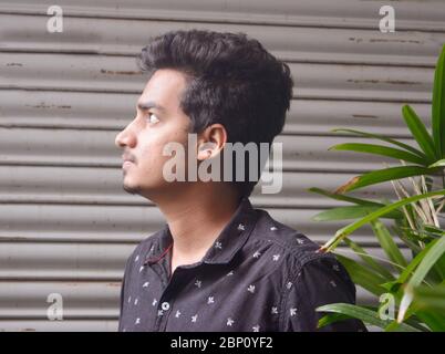 Side face view of attractive young man, man looking away. Stock Photo