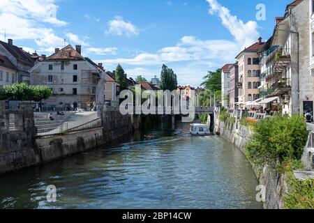 Ljubljana River in the largest city of Slovenia and a lot of historical building in the city center. June 2019 Stock Photo