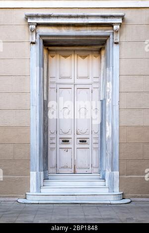 Closed old white wooden house door. Stock Photo