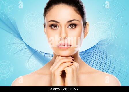 Beautiful woman face portrait on blue technology background Stock Photo