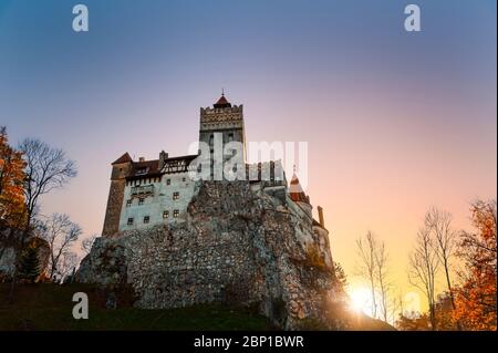 Bran Castle Museum (Dracula's Castle), near Brasov, Transylvania, Romania. Famously known as the Castle of Dracula. Beautiful exterior view at sunset Stock Photo