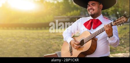 Mexican musician play guitar. Stock Photo