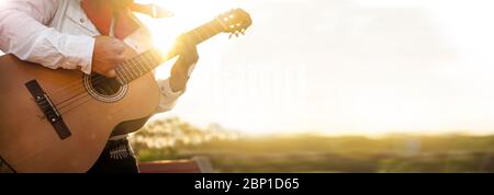 Mexican musician play guitar. Stock Photo