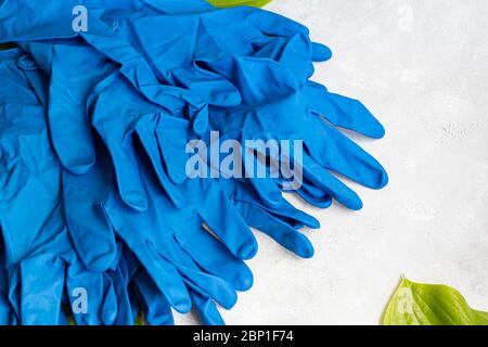Disposable gloves for cleaning, and against the virus. On a gray background. Copy space. Stock Photo