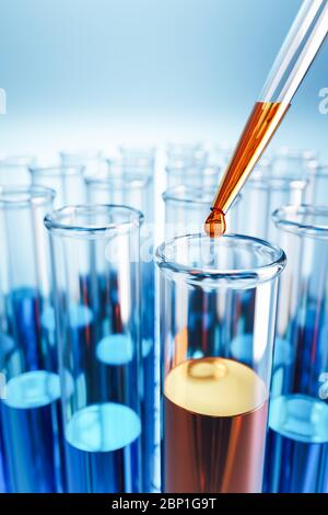 Closeup of test tubes with orange or blue liquid. Dropping glass with an orange drop above. Testing laboratory, SARS-CoV-2 test, chemical testing faci Stock Photo
