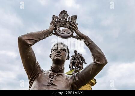 A statue of the character Prince Hal (Henry V) and William Shakespeare on the apex of the Gower Monument, Stratford Upon Avon, England Stock Photo