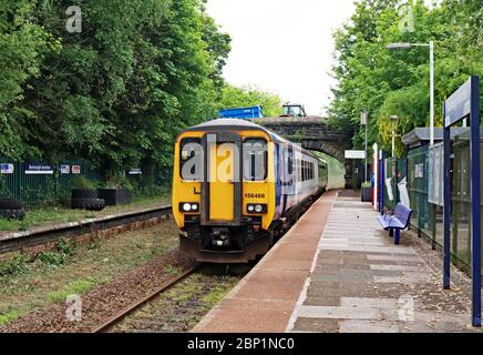 A train passes through Burscough Junction station with a route refresher train in readiness for restarting passenger services along this branch line. Stock Photo