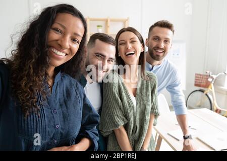 Close up headshot portrait picture of diverse team taking selfie. Stock Photo